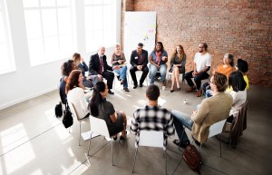 A group of people sitting in a circle